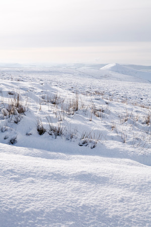 Winter scene of countryside covered in snow. Derbyshire, Peak District, UKの写真素材