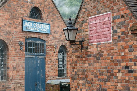 IRONBRIDGE, UK - CIRCA 2013: Exterior of red brick workshops at Blists Hill Victorian Museum, Ironbridge, Shropshire, UKのeditorial素材