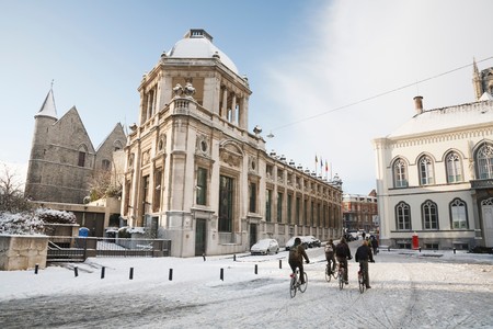 GHENT, BELGIUM - CIRCA 2010: School children cycling in winter through the streets of Ghent, Belgiumのeditorial素材