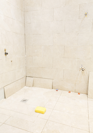 Bathroom wet room tiling and shower installationの写真素材