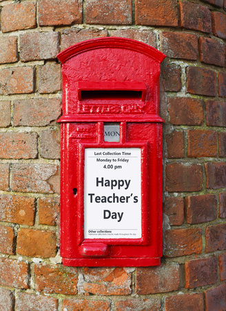 British post box with a message that reads Happy Teachers Day, ideal for a greeting card designの写真素材