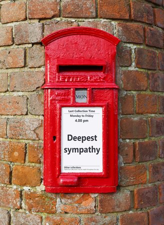 British post box with a message that reads Deepest Sympathy, ideal for a greeting card designの写真素材