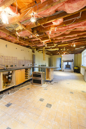A kitchen is partially removed in a rip out prior to a renovation and refitの写真素材