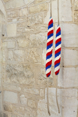 Ropes for ringing bells in an ancient church in England, UK. With copy space, depicts campanology and Christianityの写真素材