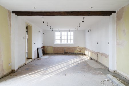 Empty room in an old house undergoing refurbishment, remodeling and redecoration, in preparation for a kitchen refitの写真素材