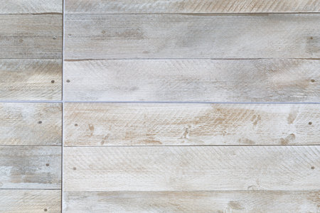 Closeup of porcelain floor tiles with wood plank floorboard effect texture/pattern