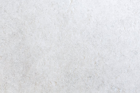 Closeup of neutral coloured texture pattern on a stone effect porcelain floor tileの写真素材