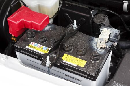 Buckingham, UK - May 16, 2019. Car battery is fitted in a car engine compartment of a Suzuki Jimny. The lead acid car battery is designed for easy replacement.のeditorial素材