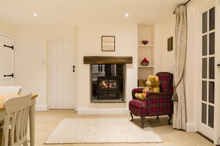 Country house interior with wood burning stove in winterの写真素材