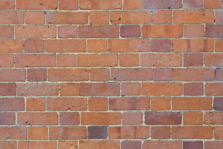 Brick wall texture background of red and orange bricksの写真素材