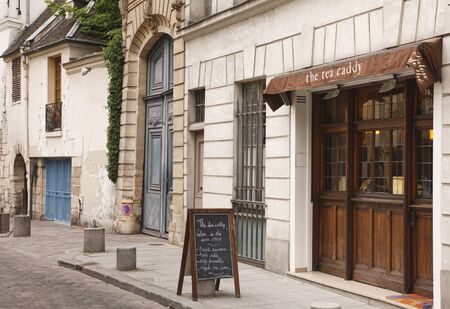 PARIS, FRANCE - May 09, 2009. Street scene with tea shop cafe on Rue St Julien le Pauvre, Paris, Franceのeditorial素材
