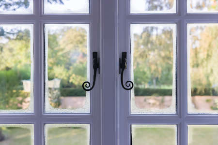Condensation on double glazed wooden windows due to cold bridging, UKの写真素材