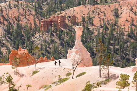 BRYCE CANYON, UT - May 26, 2012. Caucasian couple hike on a path through landscape of Bryce Canyon National Park, Utah, USAのeditorial素材
