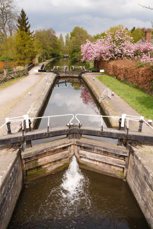 Canal lock on Grand Union Canal. London, UKの写真素材