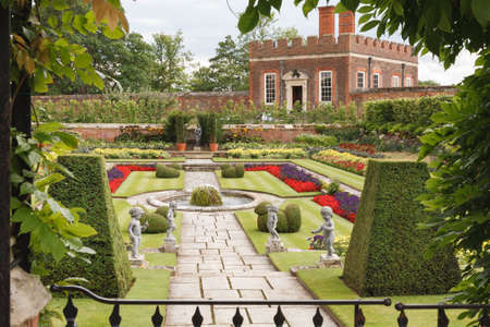 LONDON, UK - July 22, 2011. Hampton Court Palace Gardens. Pond gardens and Banqueting House at Hampton Court Palaceのeditorial素材