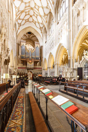 WELLS, UK - October 07, 2011. The Quire or Choir inside Wells Cathedral. With prayer books, church pews and church organ. Wells, Somerset, UKのeditorial素材