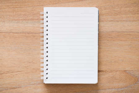 Blank spiral bound notebook journal open on a desk. Flat lay design for journaling, school or message conceptの写真素材