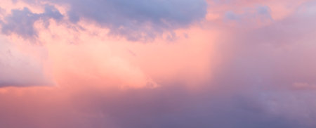 Dramatic sky at sunset with rain clouds before a storm or thunder. Ideal for a background sceneの写真素材