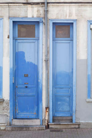 LILLE, FRANCE - July 19, 2013. Old blue painted doors outside French houses in a street in Lille, Franceのeditorial素材