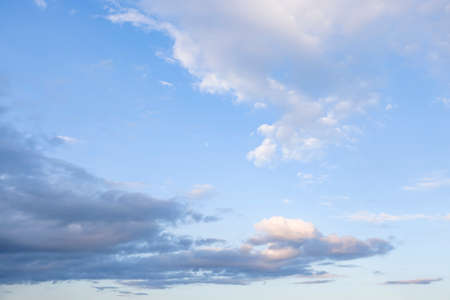 Blue sky with rain clouds in late afternoon. Ideal for a background or templateの写真素材