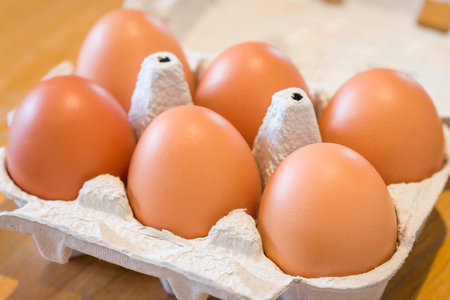 Egg carton, a half dozen free range eggs in a recycled cardboard box, UK