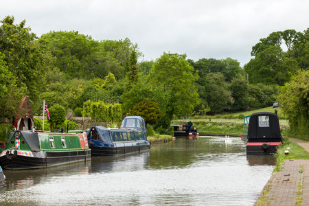 NORTHAMPTONSHIRE, UK - May 25, 2022. Narrowboats on the Grand Union Canal at Stoke Bruerne villageのeditorial素材