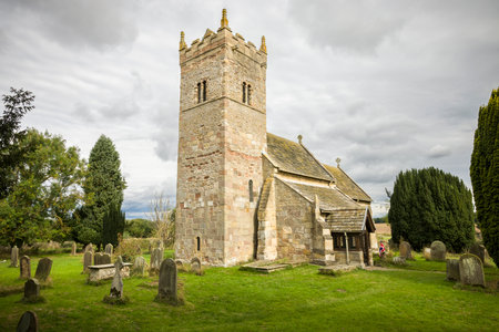 Church exterior, Holy Trinity Norman church in Little Ouseburn, Yorkshire, UKの写真素材