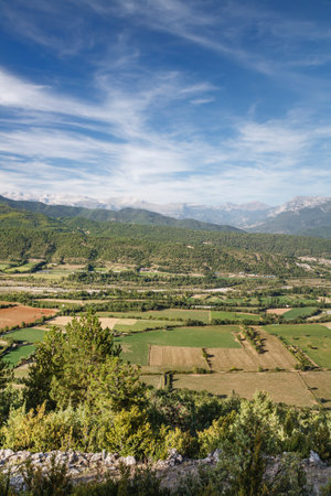 Spanish farming landscape. Patchwork of fields in Aragon, Spain, with Pyranees mountains in the distanceの写真素材