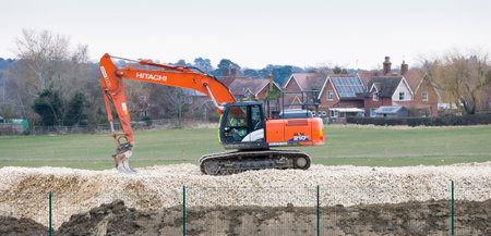 BUCKINGHAMSHIRE, UK - February 13, 2021. Heavy machinery on a railway construction site near Verney...