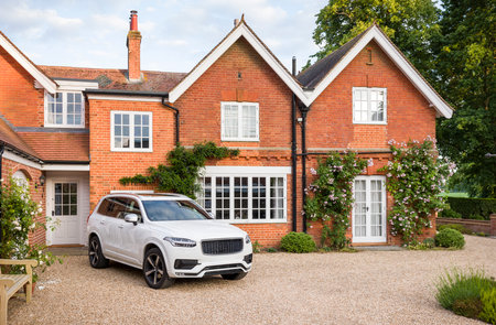 Large executive mansion house and luxury car in a rural setting, Buckinghamshire, England, UKの写真素材