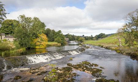 Weir on the Dales Way, River Wharfe at Linton Falls. Grassington, Wharfedale, Yorkshire Dales, UKの写真素材