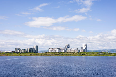 Modern development of high rise apartments on the North Sea coast, with blue water and sky....