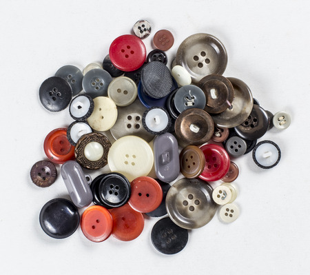 Collection of various sewing button on white background.の写真素材