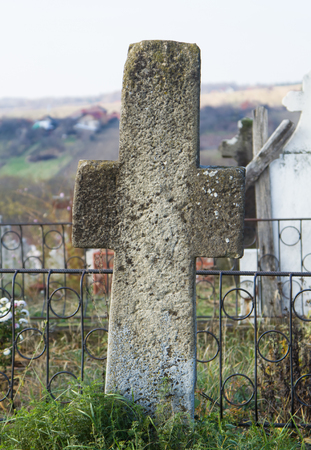 Old stone cross in cemeteryの写真素材