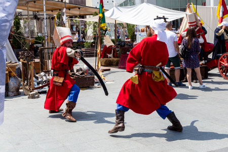 Craiova, Dolj County, Romania â May 14, 2022:  Fighters in authentic historical clothing at the medieval festival Michael le Brave .Reconstruction of a medieval battle.のeditorial素材