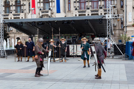 Craiova, Dolj County, Romania â May 14, 2022:  Fighters in authentic historical clothing at the medieval festival Michael le Brave .Reconstruction of a medieval battle.のeditorial素材