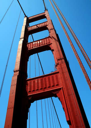 Looking up at a tower of the Golden Gate Bridge in San Francisco