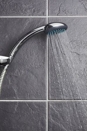 Shower in contemporary grey tiled bathroomの写真素材