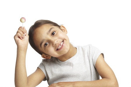 Young girl with missing front tooth on white backgroundの写真素材