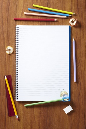 Back to School pupils art pencils and pad on wooden school desk from aboveの写真素材