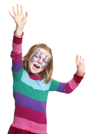 Young girl with face painting cat smiling on white backgroundの写真素材