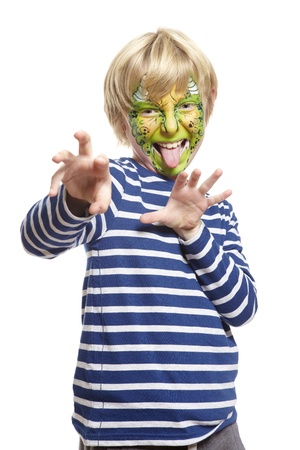 Young boy with face painting monster smiling on white backgroundの写真素材