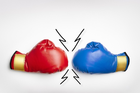 Red and blue boxing gloves on white background