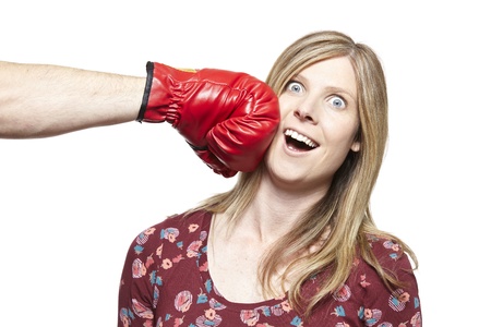 Young couple fighting with boxing gloves smiling on white backgroundの写真素材