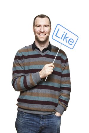 Man holding a social media sign smiling on white backgroundの写真素材