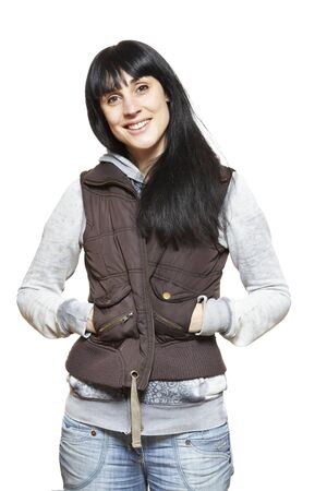 Casually dressed young woman smiling on white backgroundの写真素材