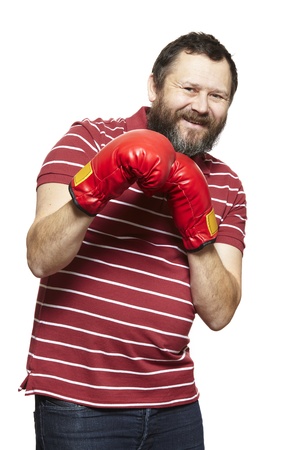Man wearing boxing gloves smiling on white backgroundの写真素材