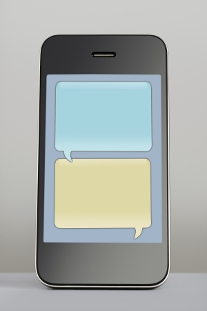 Mobile phone with empty text message speech bubbleの写真素材