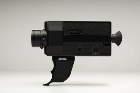 Vintage movie film cine camera isolated on plain backgroundの写真素材