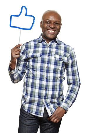 Man holding a social media sign smiling on white backgroundの写真素材